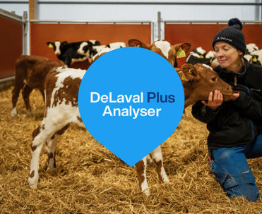 Girl cuddeling with calf - DeLaval Plus Analyser